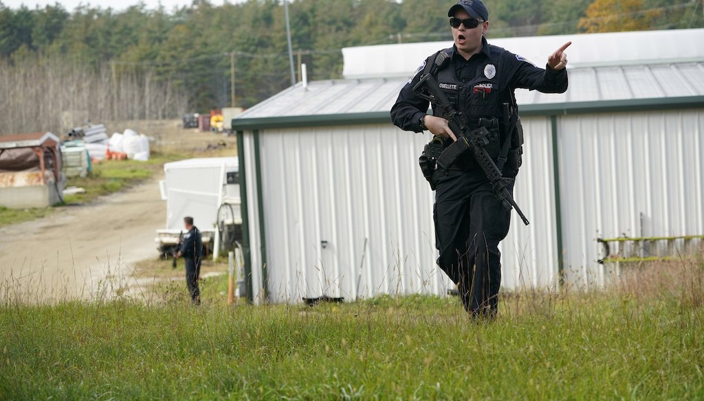 A police officer gives an order to the public during a manhunt at a farm for the suspect in this week's deadly mass shootings, Oct. 27, 2023, in Lisbon, Maine. (AP)