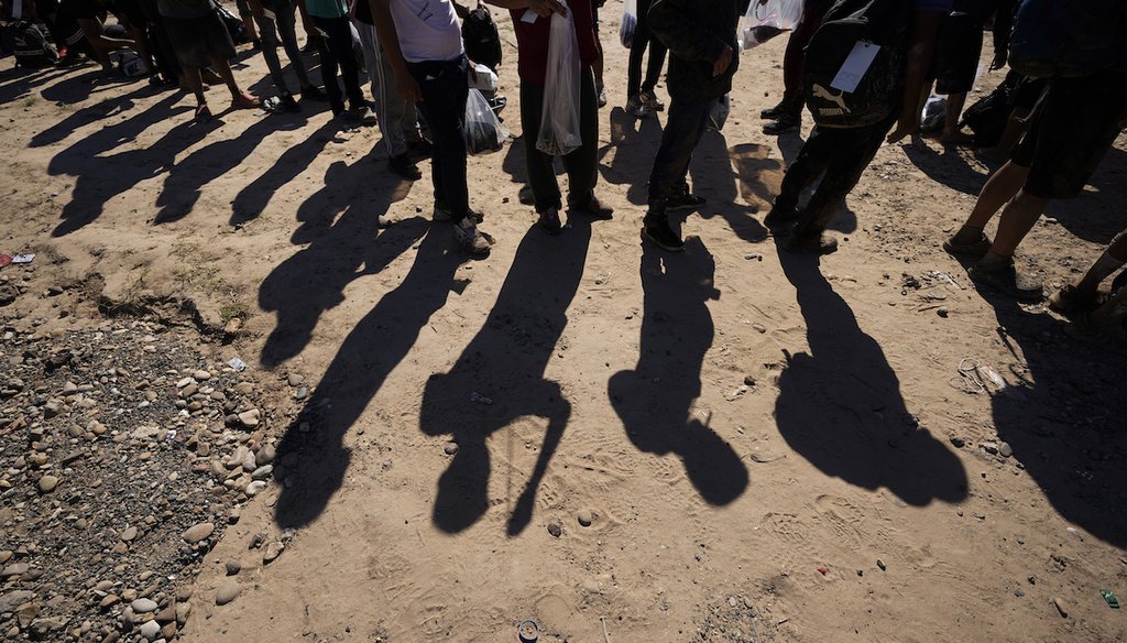 Migrants wait Oct. 19, 2023, to be processed by the U.S. Customs and Border Patrol in Eagle Pass, Texas. They had crossed the Rio Grande and entered the U.S. from Mexico. (AP)