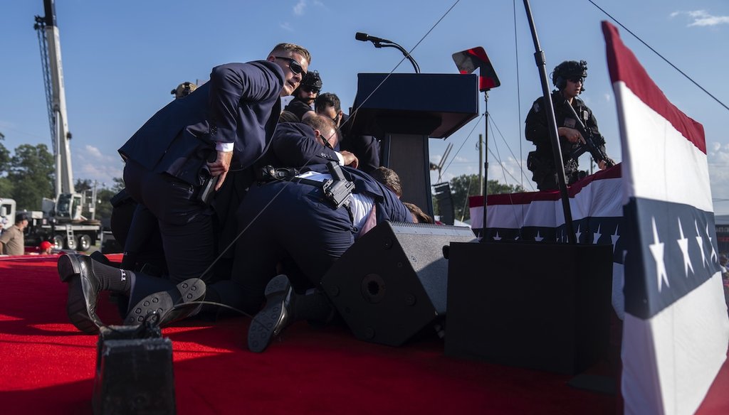 Republican presidential candidate former President Donald Trump is surrounded by U.S. Secret Service agents at a campaign rally, July 13, 2024, in Butler, Pa. (AP)