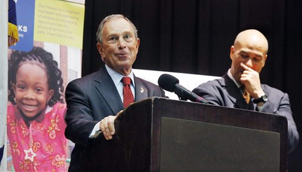 Then-Newark Mayor Cory Booker, right, laughs as then-New York City Mayor Michael Bloomberg makes a joke during an announcement on Sept. 29, 2010, in Newark, N.J. (AP/Evans)