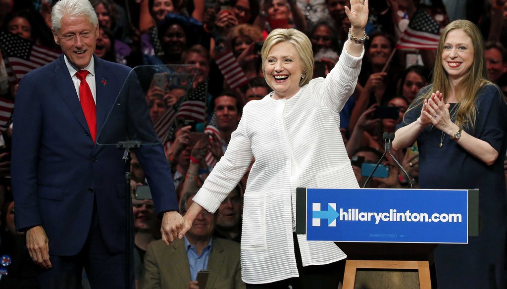 Former President Bill Clinton, left, stands on stage with his wife, Democratic presidential candidate Hillary Clinton, center, and their daughter, Chelsea Clinton, on June 7, 2016, in New York. (AP)