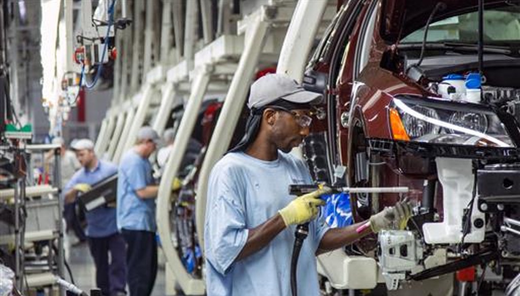 Employees at the Volkswagen plant in Chattanooga, Tenn., assemble Passat sedans on July 12, 2013. (AP/Erik Schelzig)