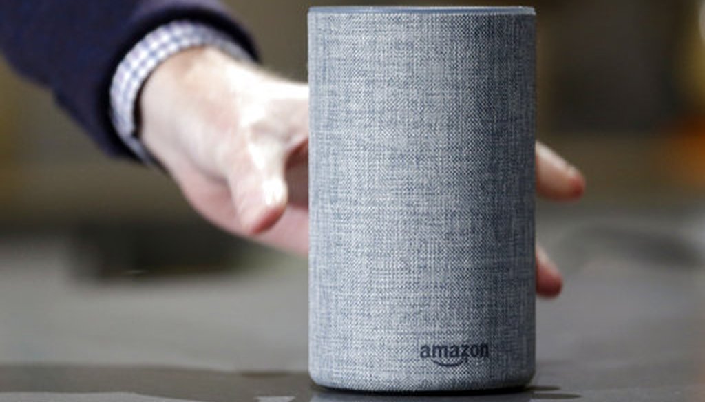 An Amazon Echo is displayed during a program announcing several new Amazon products by the company Sept. 27, 2017, in Seattle. (AP Photo/Elaine Thompson)