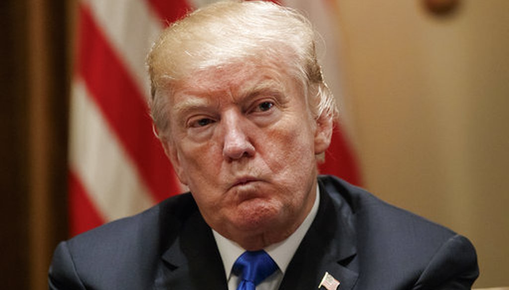 President Donald Trump pauses during a meeting in the Cabinet Room of the White House, Feb. 28, 2018, with members of Congress to discuss school and community safety. (AP Photo/Carolyn Kaster)