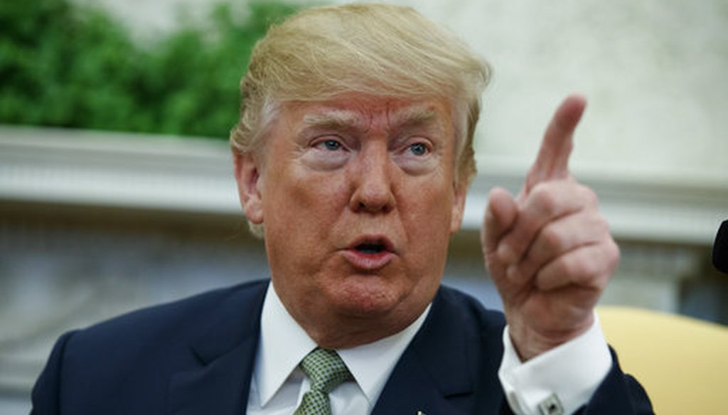 President Donald Trump talks with reporters in the Oval Office March 15, 2018. (AP Photo/Evan Vucci)