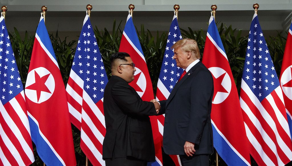 North Korean leader Kim Jong Un and U.S. President Donald Trump shake hands prior to their meeting on Sentosa Island in Singapore on June 12, 2018. (AP)