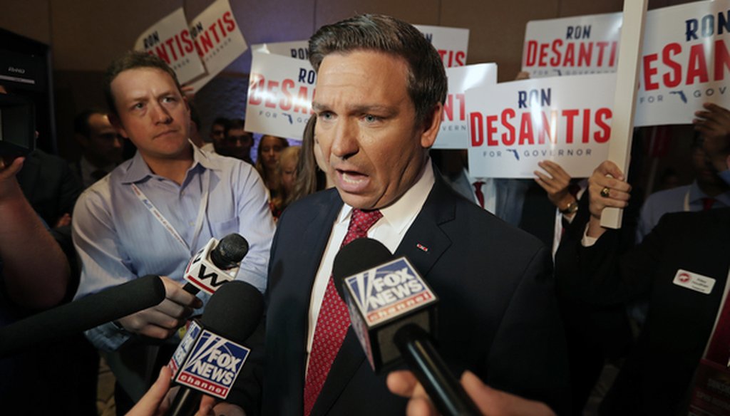 U.S. Rep. Ron DeSantis answers questions from reporters after a Florida Republican gubernatorial primary debate at the Republican Sunshine Summit Thursday, June 28, 2018, in Kissimmee, Fla. (AP Photo/John Raoux)
