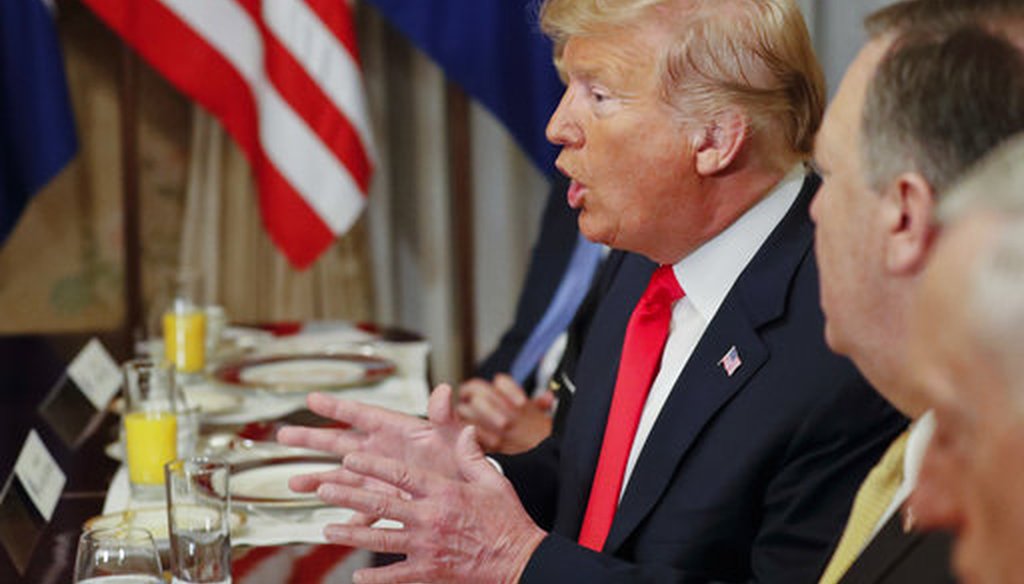 President Donald Trump gestures while speaking to NATO Secretary General Jens Stoltenberg during their bilateral breakfast on July 11, 2018 in Belgium. (AP/Pablo Martinez Monsivais)