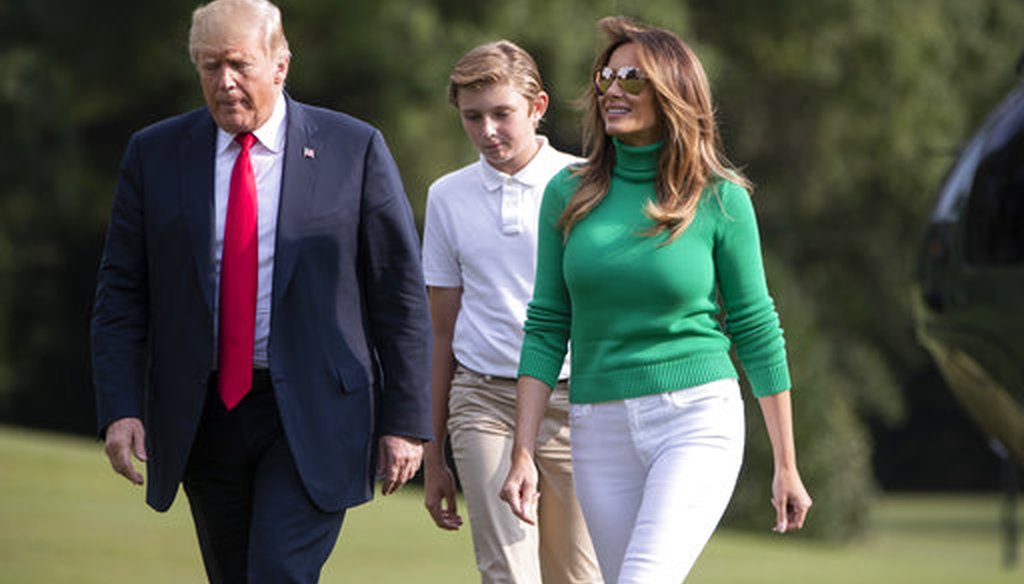 President Donald Trump, with first lady Melania Trump and their son Barron, arrives at the White House in Washington, Sunday, Aug. 19, 2018. (AP Photo/J. Scott Applewhite)