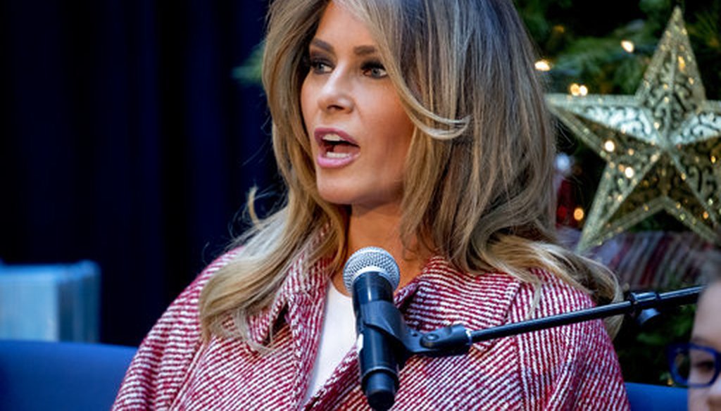 First lady Melania Trump reads "Oliver the Ornament" to children at Children's National Health System, Thursday, Dec. 13, 2018, in Washington. (AP Photo/Andrew Harnik)