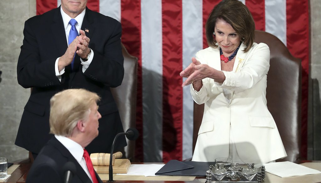 President Donald Trump turns to House Speaker Nancy Pelosi of Calif., as he delivers his State of the Union address, while Vice President Mike Pence watches, Feb. 5, 2019. (AP)