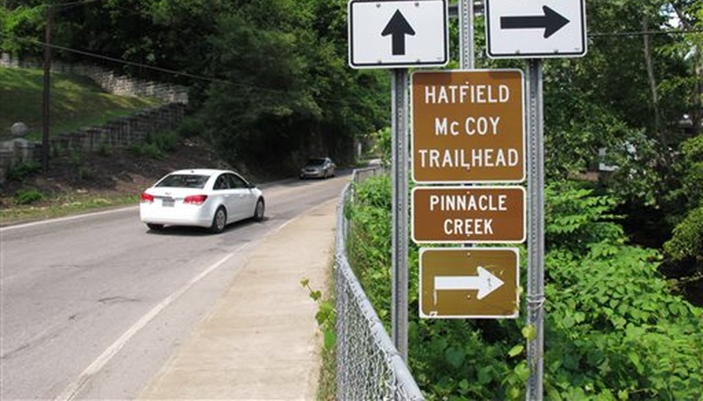 Signs advertise an all-terrain vehicle trail named for a pair of famous Appalachian feuding families in Pineville, W.V.. (AP)