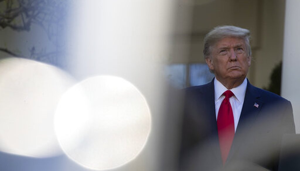 President Donald Trump stands as others speak about the coronavirus at the White House on March 30, 2020, in Washington. (AP/Brandon)