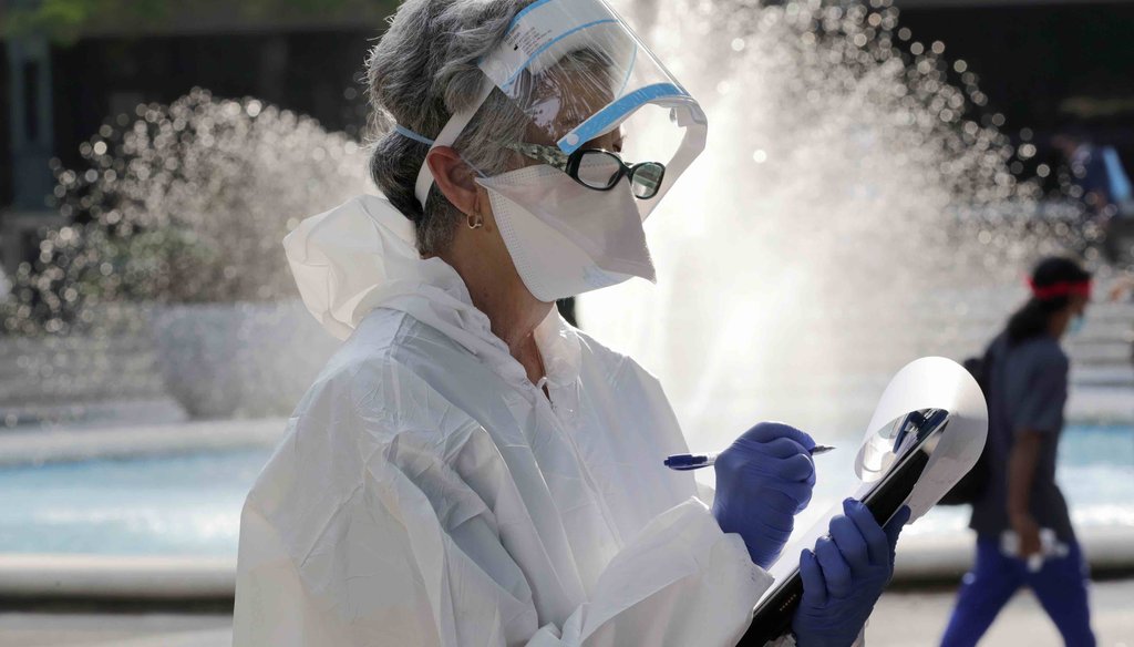 Alina Wetzstein wears personal protection equipment as she interviews the homeless for testing for COVID-19 in a program administered by the Miami-Dade County Homeless Trust, during the new coronavirus pandemic on April 16, 2020, in Miami. (AP)