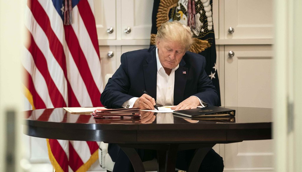 In this image released by the White House, President Donald Trump works in the Presidential Suite at Walter Reed National Military Medical Center in Bethesda, Md., on Oct. 3, 2020, after testing positive for COVID-19. (AP)