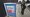 A woman puts a ballot in a drop box on Oct. 27, 2020, at a library in Seattle. (AP)