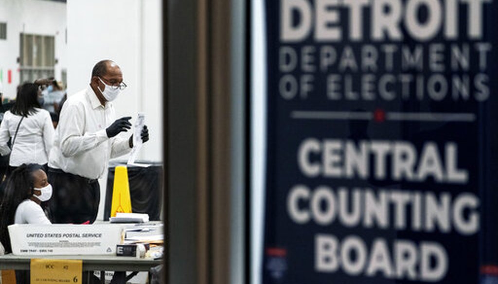 Election inspectors count ballots into the early morning hours of Wednesday, Nov. 4, 2020, at the central counting board in Detroit. (AP)