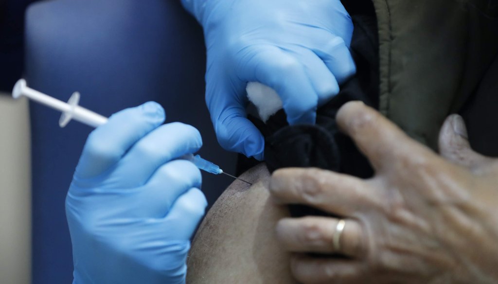 A nurse administers the Pfizer-BioNTech COVID-19 vaccine at Guy's Hospital in London on Dec. 8, 2020. (AP)