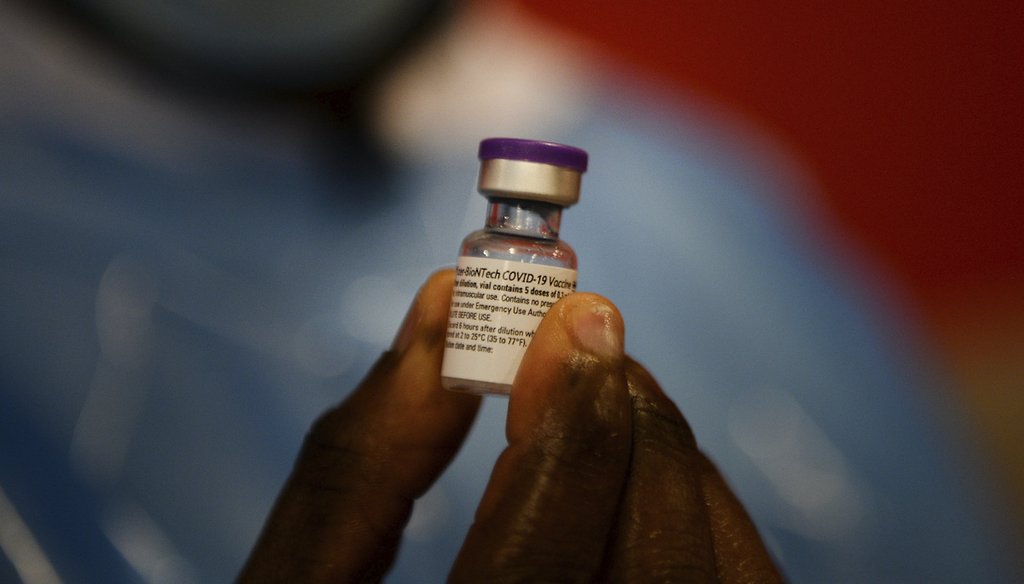 A nurse prepares a vial of the COVID-19 vaccine to administer to an elderly resident at a nursing home in Belgium, Dec. 28, 2020. (AP)