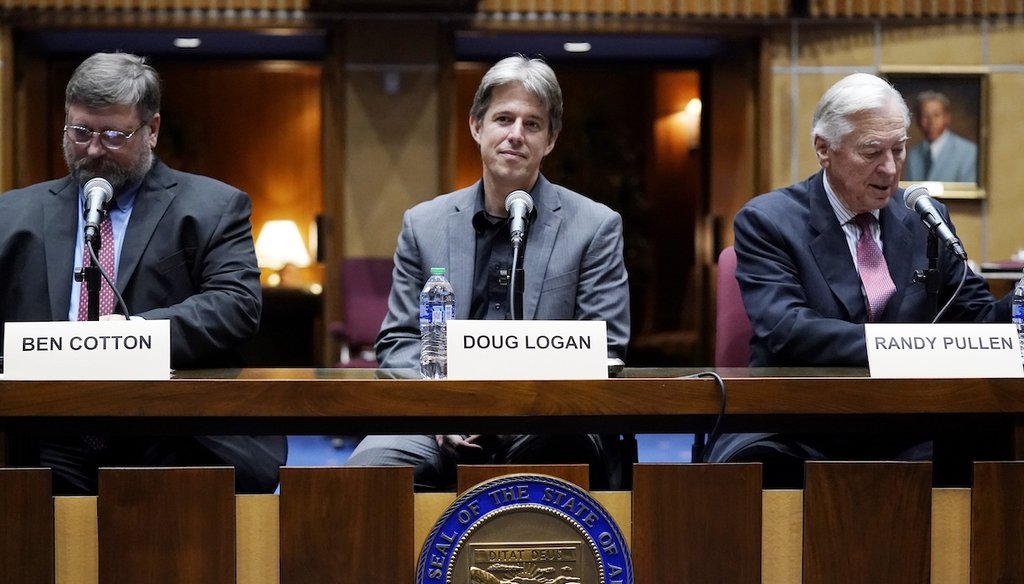 Cyber Ninjas CEO Doug Logan, center, Ben Cotton, left, founder of CyFIR, and Randy Pullen, right, the former chairman of the Arizona Republican Party, prior to the Arizona Senate Republicans hearing review of the 2020 election results in Maricopa County o