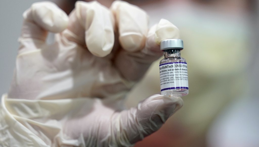 A healthcare worker holds a vial of the Pfizer COVID-19 vaccine at Jackson Memorial Hospital Tuesday, Oct. 5, 2021, in Miami. (AP)