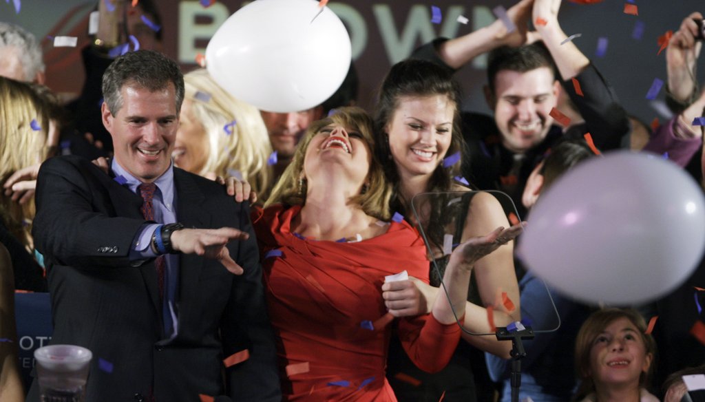 Scott Brown celebrates in Boston, Jan. 19, 2010, with wife Gail, center, and daughter Ayla, and niece Maeve Brown, right, after winning a special election held to fill the U.S. Senate seat of the late Ted Kennedy. (AP)