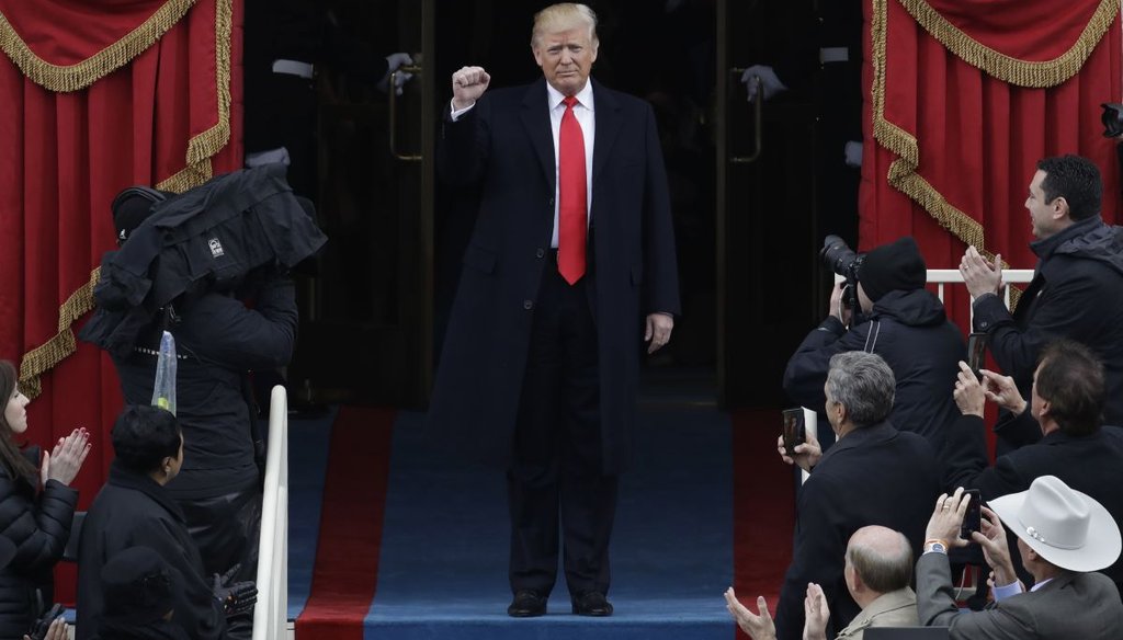 President-elect Donald Trump pumps his fist as he arrives for his Presidential Inauguration at the U.S. Capitol in Washington, Friday, Jan. 20, 2017. (AP Photo/Patrick Semansky)