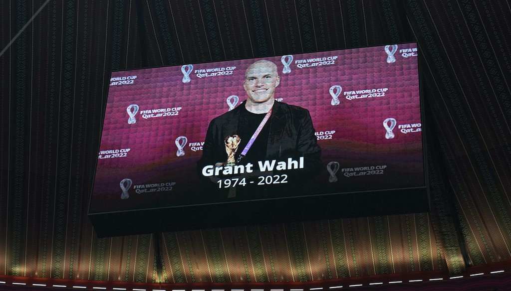 A tribute to journalist Grant Wahl is shown on a screen before the World Cup quarterfinal soccer match between England and France, at the Al Bayt Stadium in Al Khor, Qatar, Saturday, Dec. 10, 2022. (AP)