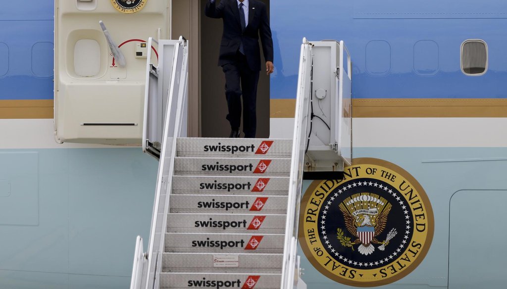 President Barack Obama waves as he steps out of Air Force One upon arriving at JFK International Airport in New York Oct. 7. (AP)