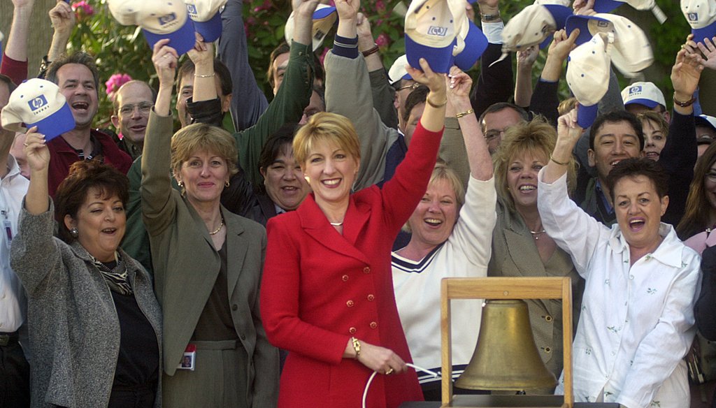 Carly Fiorina, then-chief executive of Hewlett-Packard, rings a bell to virtually open the New York Stock Exchange on May 6, 2002, after the company changed its ticker symbol from HWP to HPQ to reflect its acquisition of Compaq Computer Corp. (AP Photo)