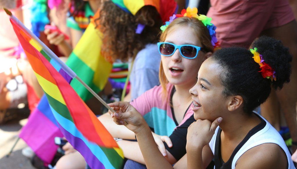 Supporters wave rainbow flags for the 2013 Pride Parade in Atlanta. AJC photo by Curtis Compton/Ccompton@ajc.com