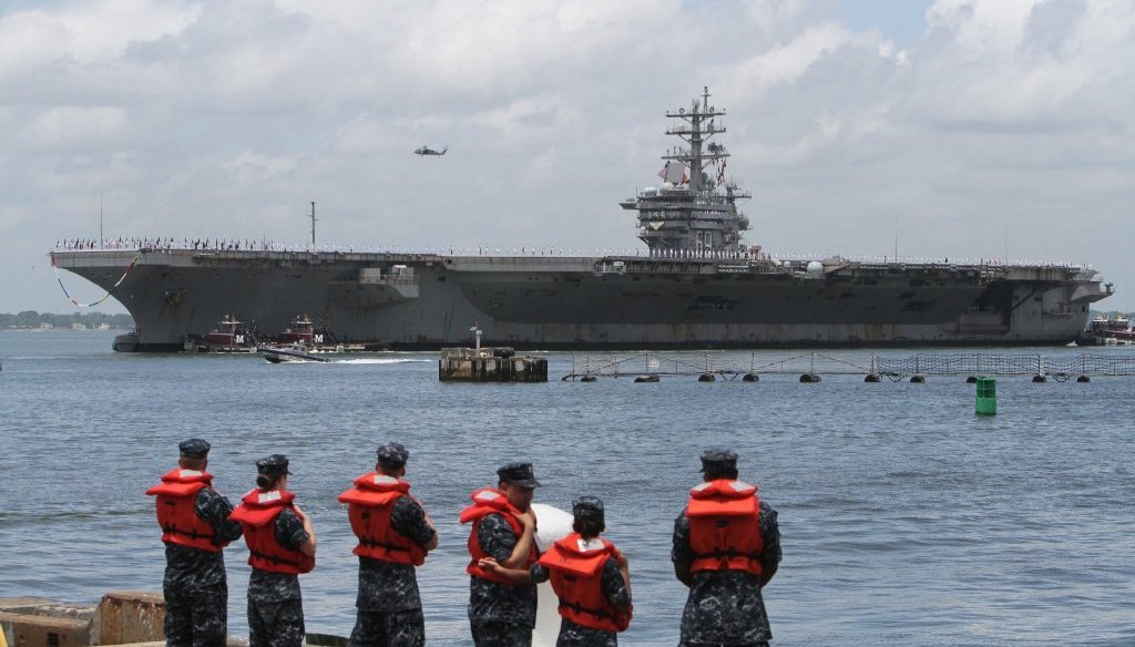 The USS Dwight D. Eisenhower arrives back at the Norfolk Naval Station on July 3, 2013. (Photo by AP/The Virginian-Pilot)