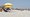 Visitors sit on the sand on Myrtle Beach, S.C., on May 2, 2020, amid the continuing coronavirus outbreak. (AP/Kinnard)