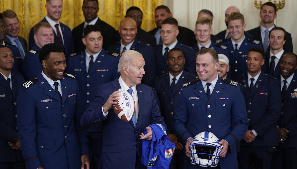 President Joe Biden holds a football during the presentation of the Commander-in-Chief's trophy to the Air Force Academy in the White House, Friday, April 28, 2023. (AP)