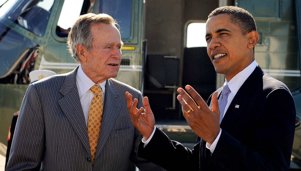 Former president George H.W. Bush and President Barack Obama honored community service leaders in 2009. The two also share a readiness to act unilaterally on immigration. (Getty Images)