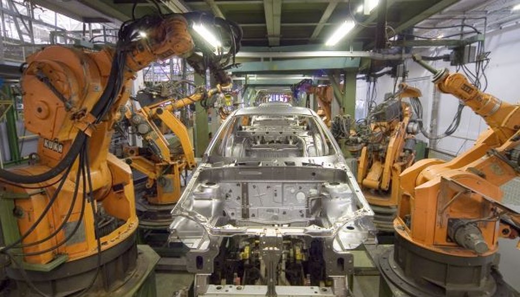 Robots are widely used in automobile manufacturing, but the number of human workers has been rising recently, too. (Wikimedia Commons)