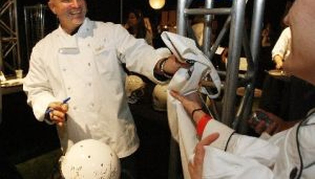 Restauranteur and Top Chef host Tom Colicchio signs autographs at the Taste of the NFL at Tropicana Field in St. Petersburg in 2009. We checked a recent tweet he sent about debt under the past five presidents.