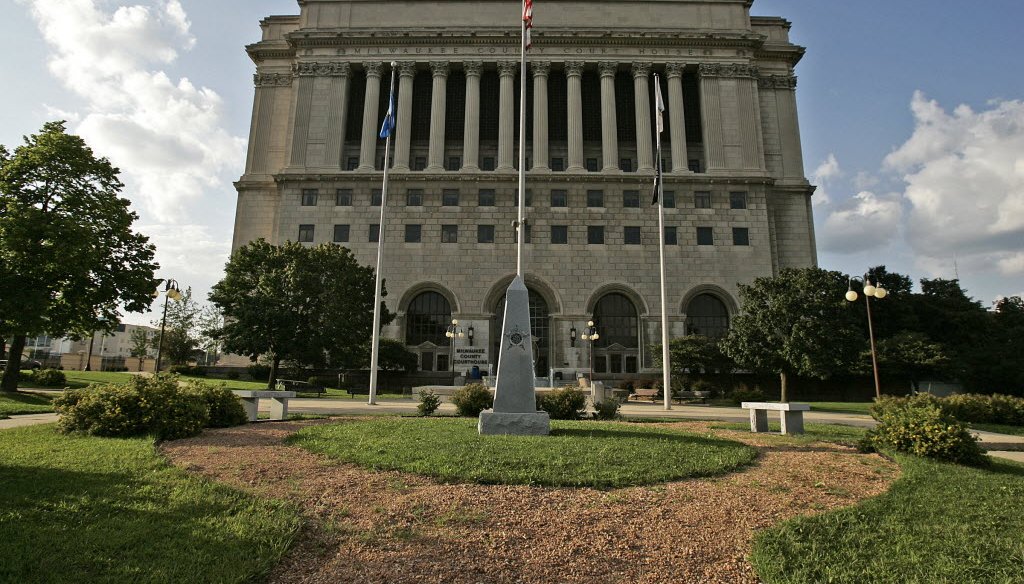 Visitors must pass through metal detectors to enter the Milwaukee County Courthouse. County workers man the detectors but a sheriff's deputy is stationed near each checkpoint.