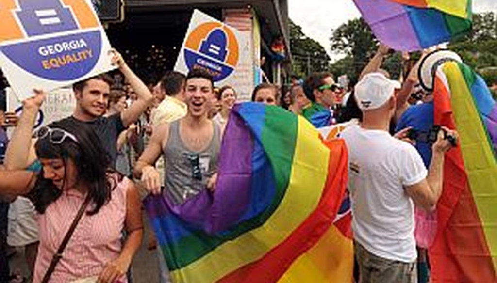 Gay rights supporters in Midtown Atlanta cheer the Supreme Court ruling on gay marriage on June 26, 2013. Ga. Rep. Ed Lindsey says marriage act author Bob Barr has changed his position on the issue over the years. (AJC Photo/Kent D. Johnson)