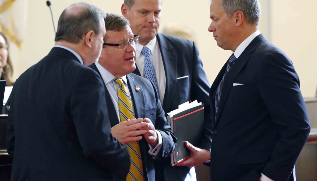 NC Lt. Gov. Dan Forest, right, talks with Republican legislative leaders Sen. Phil Berger, left, and Rep. Tim Moore, second from left. News & Observer photo.