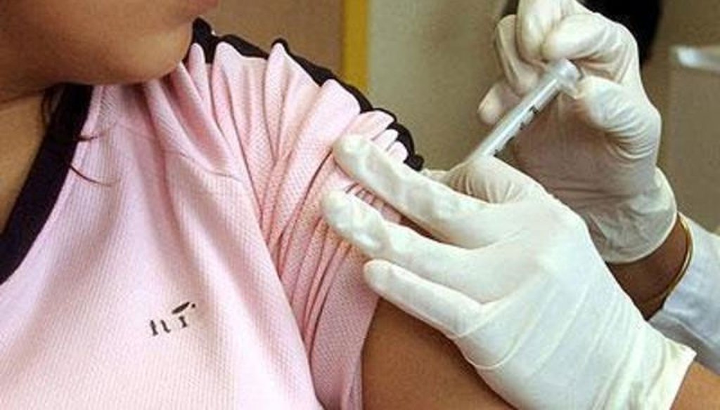 A patient receives a flu shot.