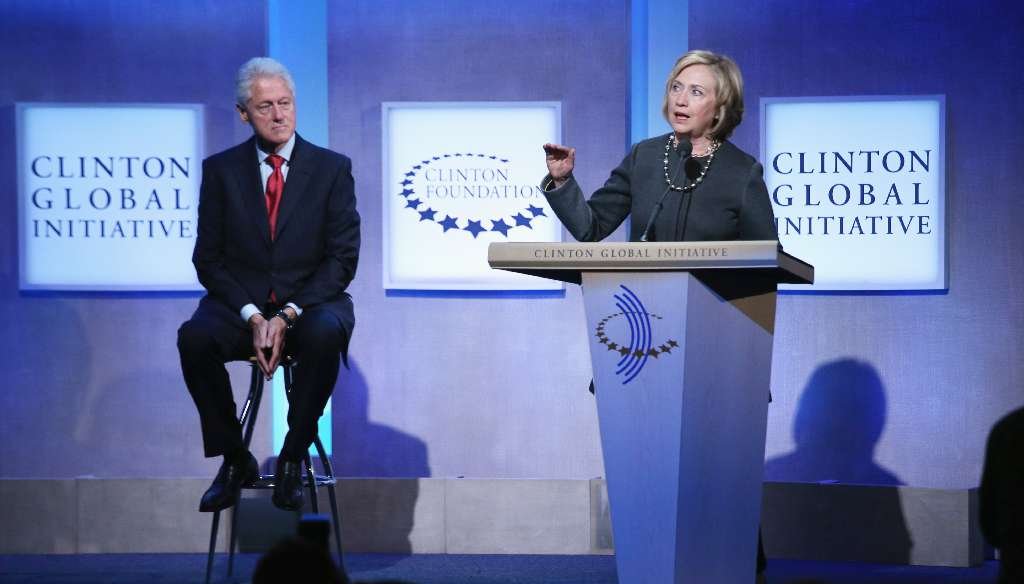 Former U.S. Secretary of State Hillary Clinton (R) speaks as former U.S. President Bill Clinton looks on during the opening plenary session of the Clinton Global Initiative (CGI), on September 22, 2014 in New York City. (John Moore/Getty Images)