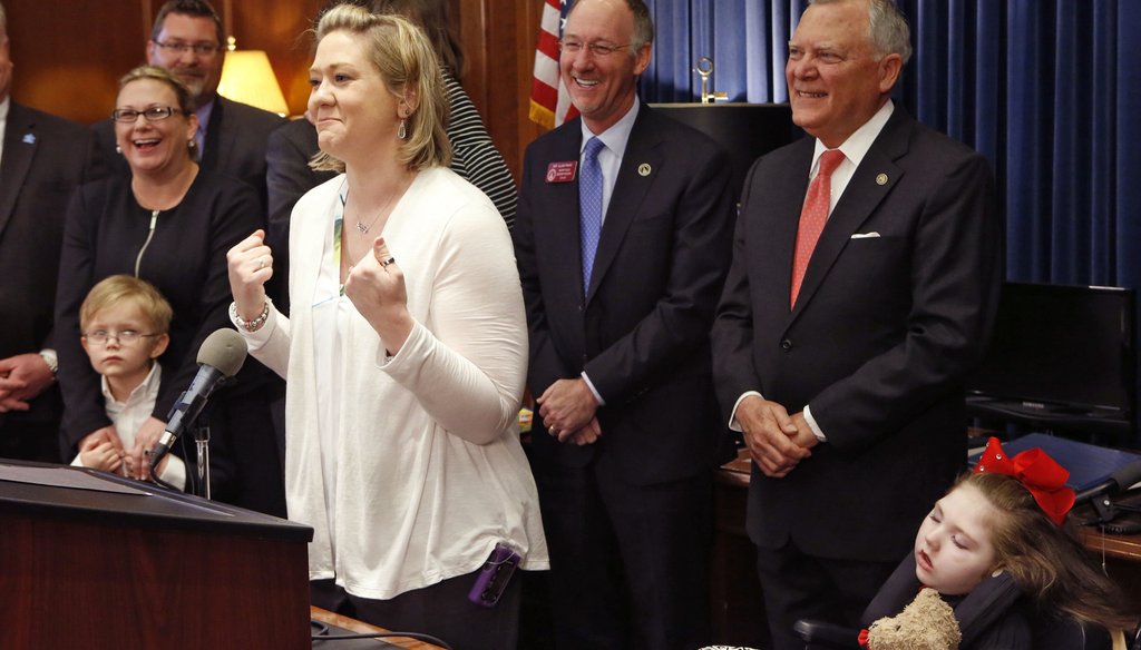 Janea Cox expresses support for a deal legalizing the cannabis oil that is expected to help control the seizures suffered by daughter, Haleigh, right. Photo by Bob Andres / AJC