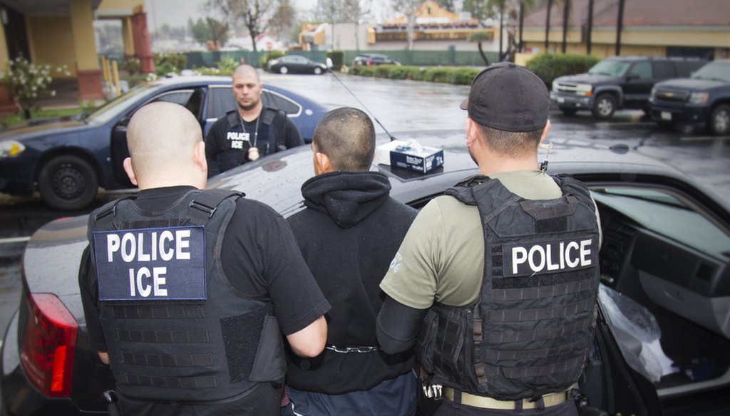 A photo released in February 2017 by U.S. Immigration and Customs Enforcement shows people being arrested during an ICE operation. Charles Reed/U.S. Immigration and Customs Enforcement / AP