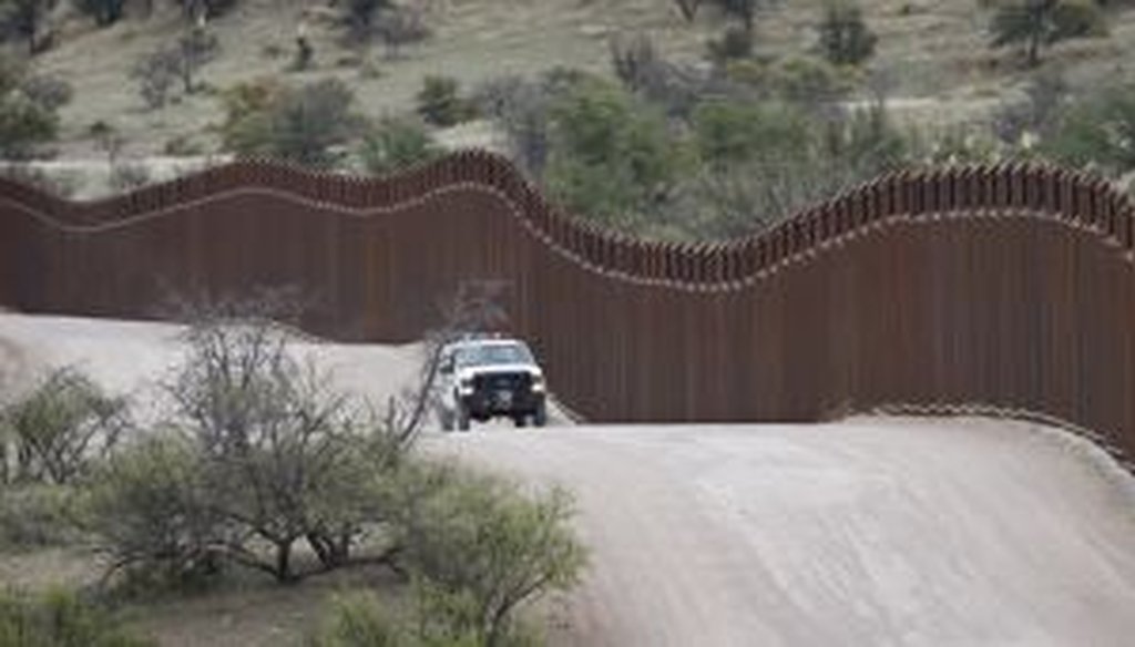 A border patrol agent monitors the international border in Arizona.