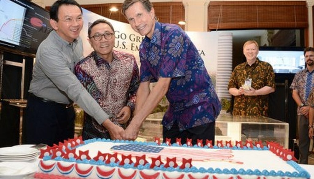 A July 4th celebration at the U.S. Embassy in Jakarta’s featuring Amb. Robert O. Blake, guests, and a red, white and blue cake. (State Department/Erik A. Kurniawan)