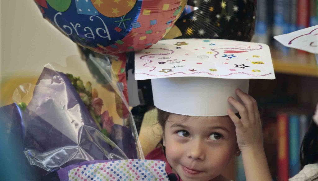 Zoe Betancourt wore a "Grad Princess" sash to her pre-K graduation at Aversboro Elementary School in Garner, NC, in June 2016 where she also got flowers and a balloon. News & Observer photo.