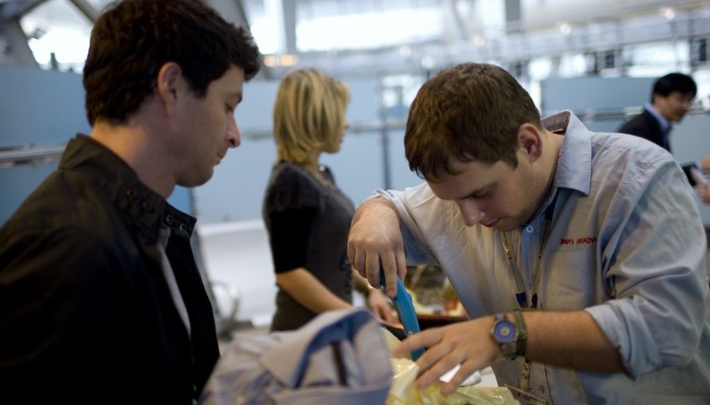 A passenger has his luggage checked by security personnel at Ben Gurion Airport. Ariel Schalit/AP)