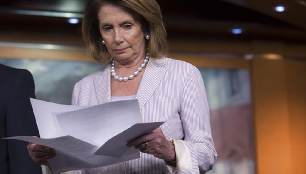 House Minority Leader Nancy Pelosi of California, looks over her remarks before a news conference on Capitol Hill July 14, 2017, where she renewed calls for a vote on an independent commission to investigate Russia's involvement in the election. (AP)