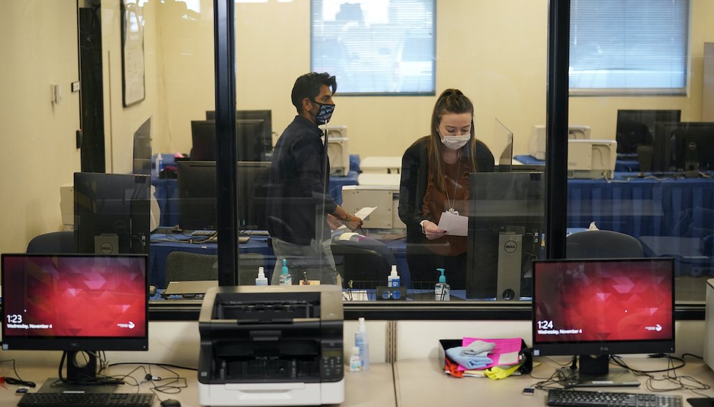 County election workers conduct a testing certification of the counting system at the Clark County Election Department, Wednesday, Nov. 4, 2020, in Las Vegas. (AP)